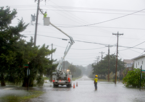 telephone poles knocked down on ground hurricane