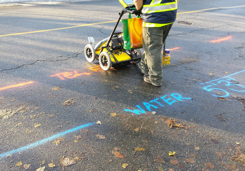 Utility location is the process of identifying and labeling public utility mains that are underground. These mains may include lines for telecommunication, electricity distribution, natural gas, cable television, fiber optics, traffic lights, street lights, storm drains, water mains, and wastewater pipes. In some locations, major oil and gas pipelines, national defense communication lines, mass transit, rail and road tunnels also compete for space underground.