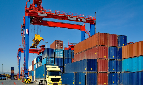 Cargo freight being loaded on to a semi-truck