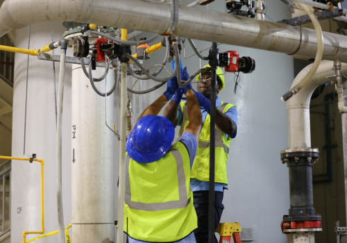 Utility workers working on restoring water after natural disaster