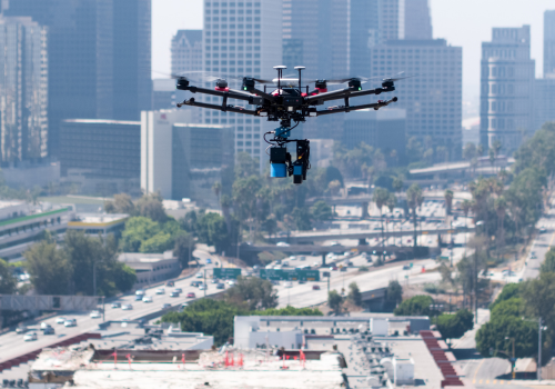 Large drone flying over construction site in downtown Los Angeles