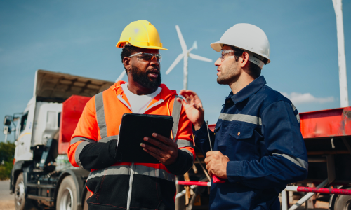 2 construction workers talking