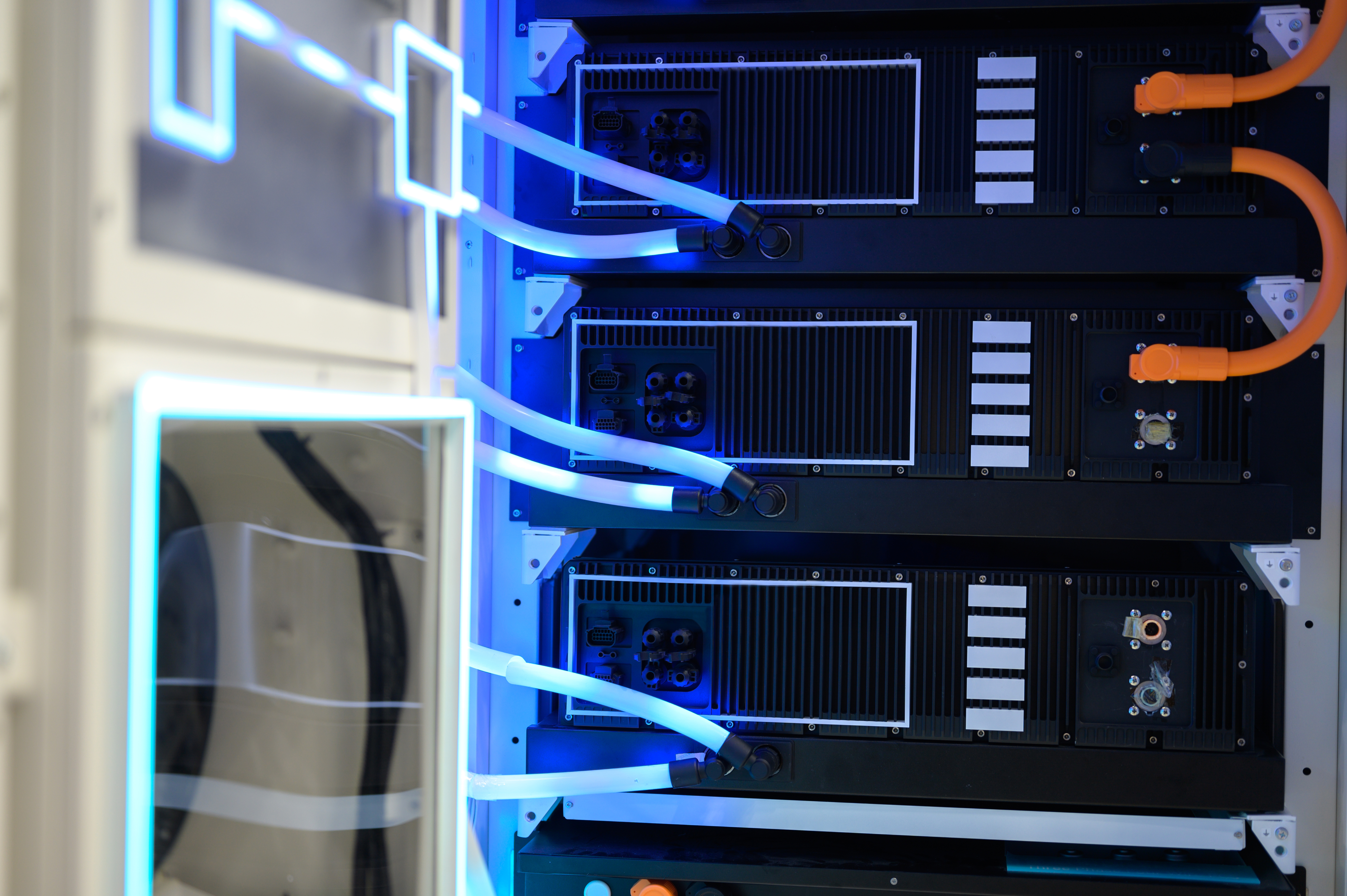 close view of high-end server rack with liquid cooling, used in data centers for artificial intelligence, cloud storage, and tech infrastructure environments.