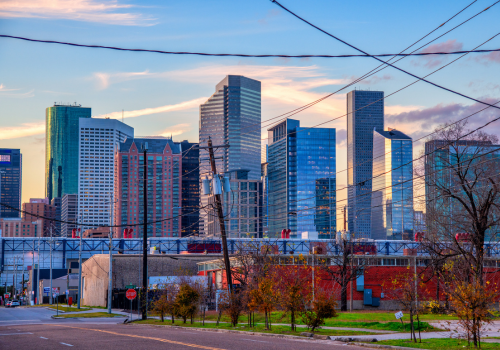 Houston The downtown building rising up beyond an adjacent neighborhood just east of the city center known as the "East End" or "Eado"