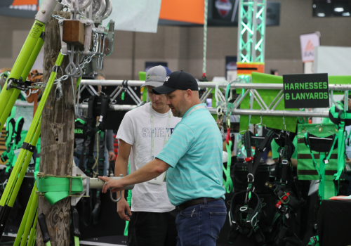 Attendees checking out new safety harness technology at The Utility Expo 2023