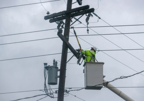 Lineworker boom truck working on telephone lines