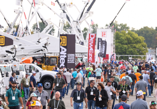 A crowd of attendees visiting the Altec booth at The Utility Expo 2023 to learn about electrical jobsite safety