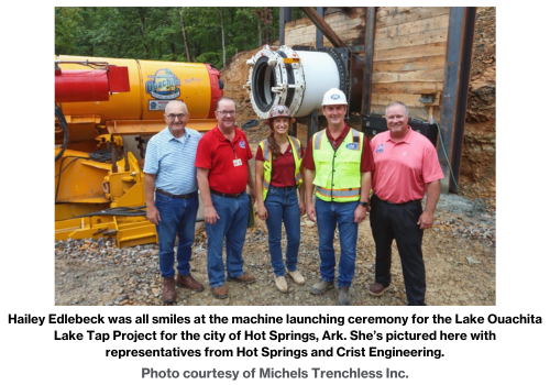 Hailey Edlebeck was all smiles at the machine launching ceremony for the Lake Ouachita Lake Tap Project for the city of Hot Springs, Ark. She’s pictured here with representatives from Hot Springs and Crist Engineering. Photo courtesy of Michels Trenchless Inc.