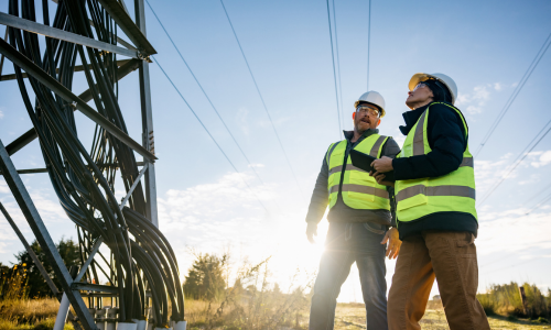 Two utility workers talking 