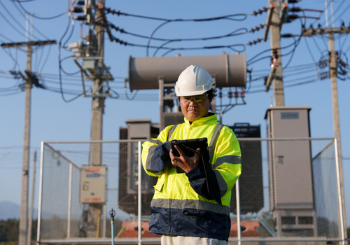 An expert engineer is inspecting a high-voltage transformer in a remote rural area.